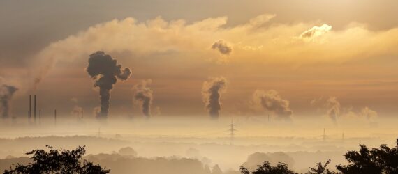 A cloud of smog above a skyline horizon
