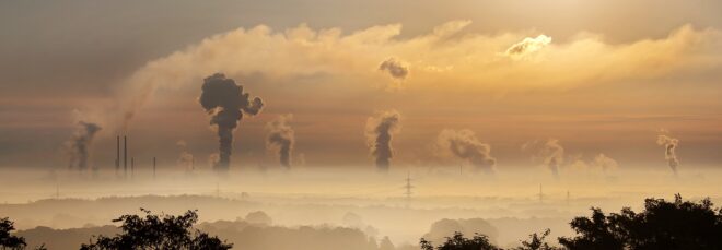 A cloud of smog above a skyline horizon