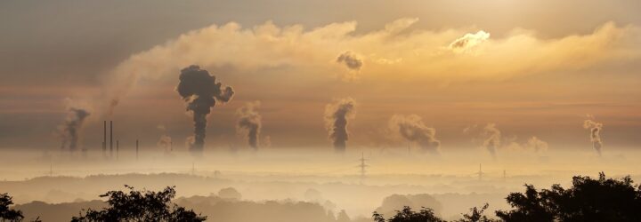 A cloud of smog above a skyline horizon