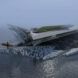 Aerial view of futuristic building with angular canopy floating in the ocean