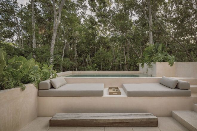 An outdoor pool and lounge area