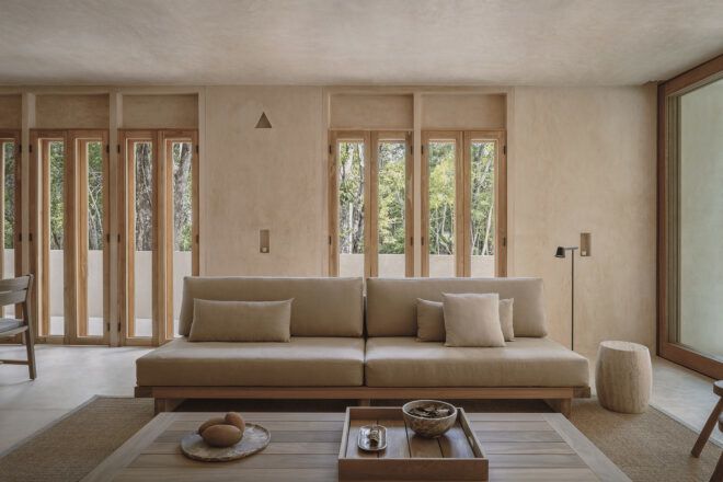 An interior living room space in cream tones