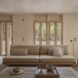 An interior living room space in cream tones
