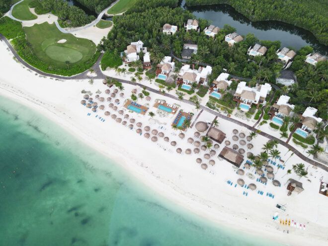 An aerial map of a resort beside a beach
