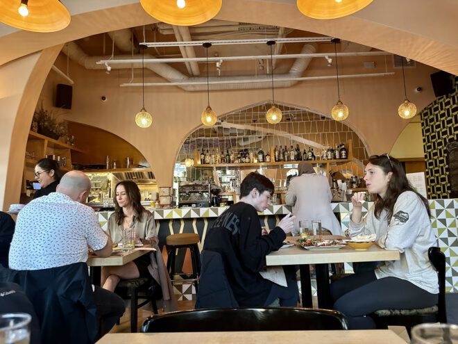 A dining and bar area filled with people