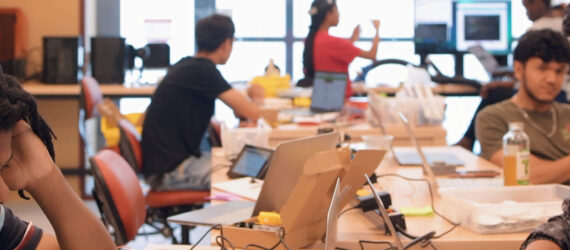 Students working on laptops and desktop computers on STEM related activities