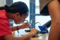 Student intently focused on a STEM activity