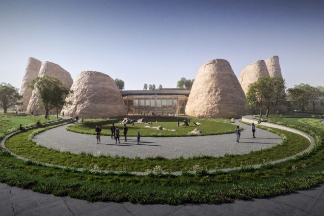 Curving garden in front of a modern building flanked by large earth cone-like forms