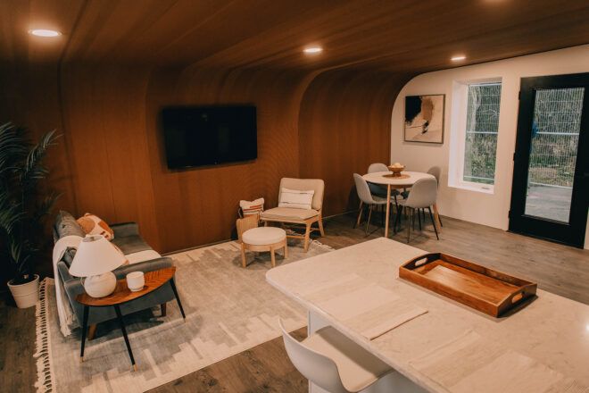 An interior living room with wooden walls