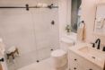 A bathroom with a standing shower