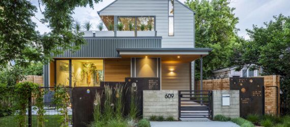 Front facade of the Fargo house with a front porch and an open terrace area on the top level