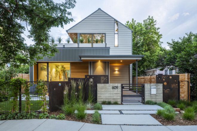Front facade of the Fargo house with a front porch and an open terrace area on the top level