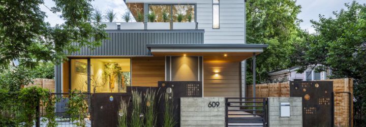 Front facade of the Fargo house with a front porch and an open terrace area on the top level