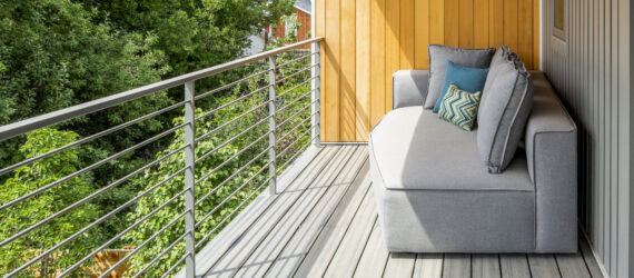 Grey sofa in a covered terrace