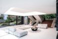 A living room space with white sofas