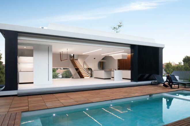 An outdoor pool leads into an open wall to the living room