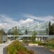 Zig-zag building facade with a sloped pollinator garden outside