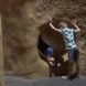 Two children crawling through a tunnel