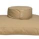 A tan circular cushion on top of a square cushion