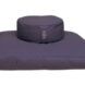 A purple circular cushion on top of a square cushion