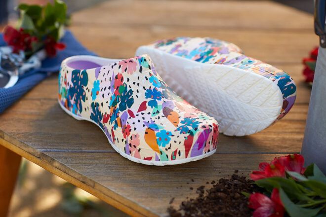 Floral patterned white clogs