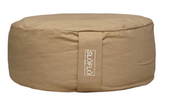 A circular tan cushion