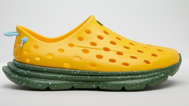 A yellow slip-on shoes with green sole