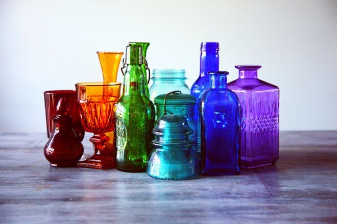 A variety of glass bottles in rainbow color