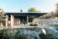 An open architecture with a pond in front of it