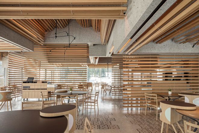 A dining hallway designed with wooden beams