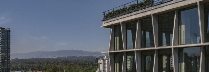 Aerial view of the Castelar 75 facade with Mexico City's skyline and landscape in the background