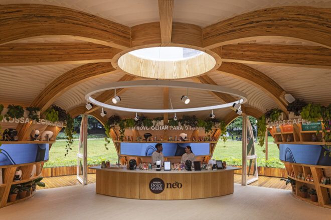 Two people behind the counter at the Dolce Gusto Neo flagship store