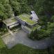 A home with the roof covered in green